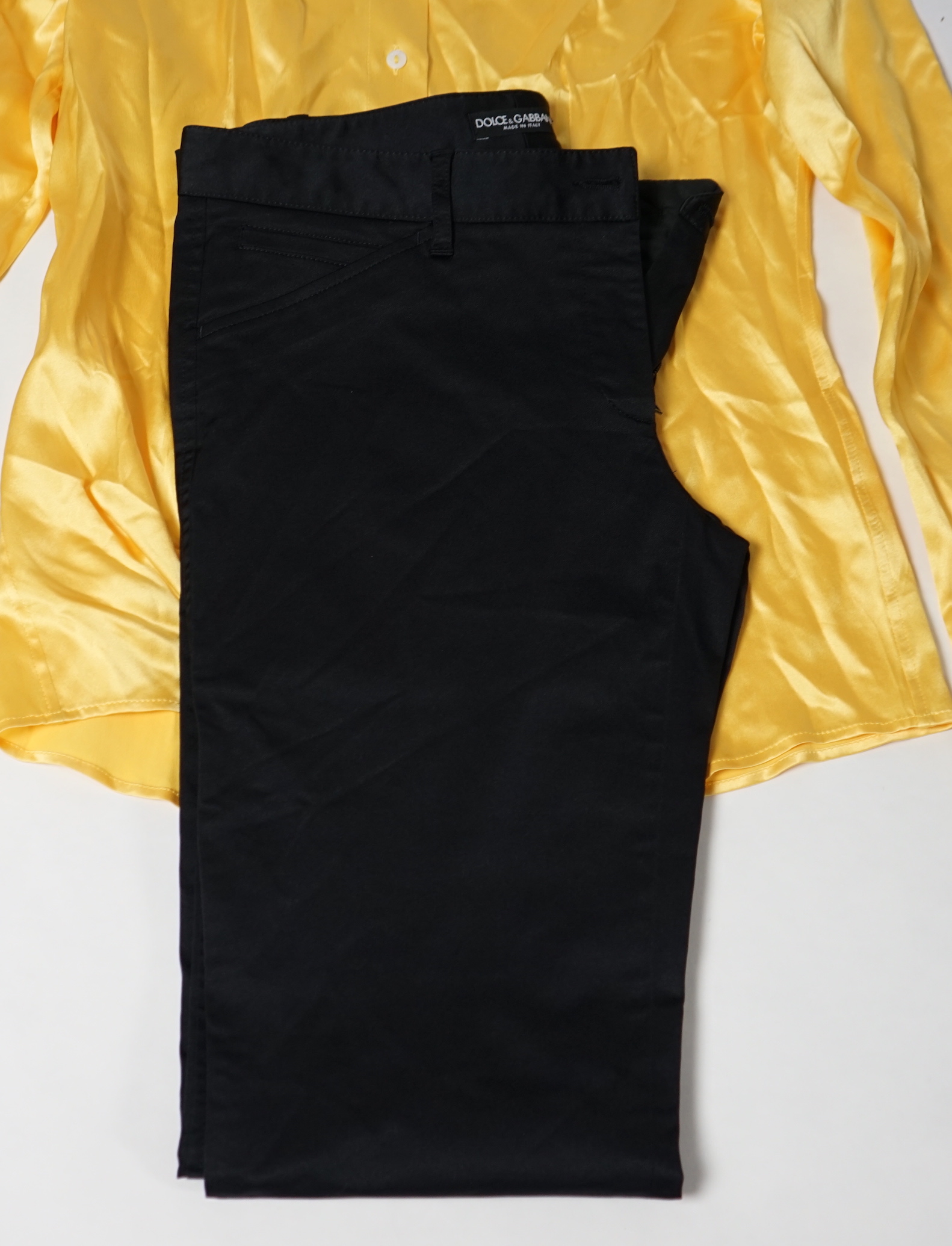 A lady's Dolce & Gabbana yellow silk blouse and a pair of black satin jeans. Blouse size 44 Trousers size 42